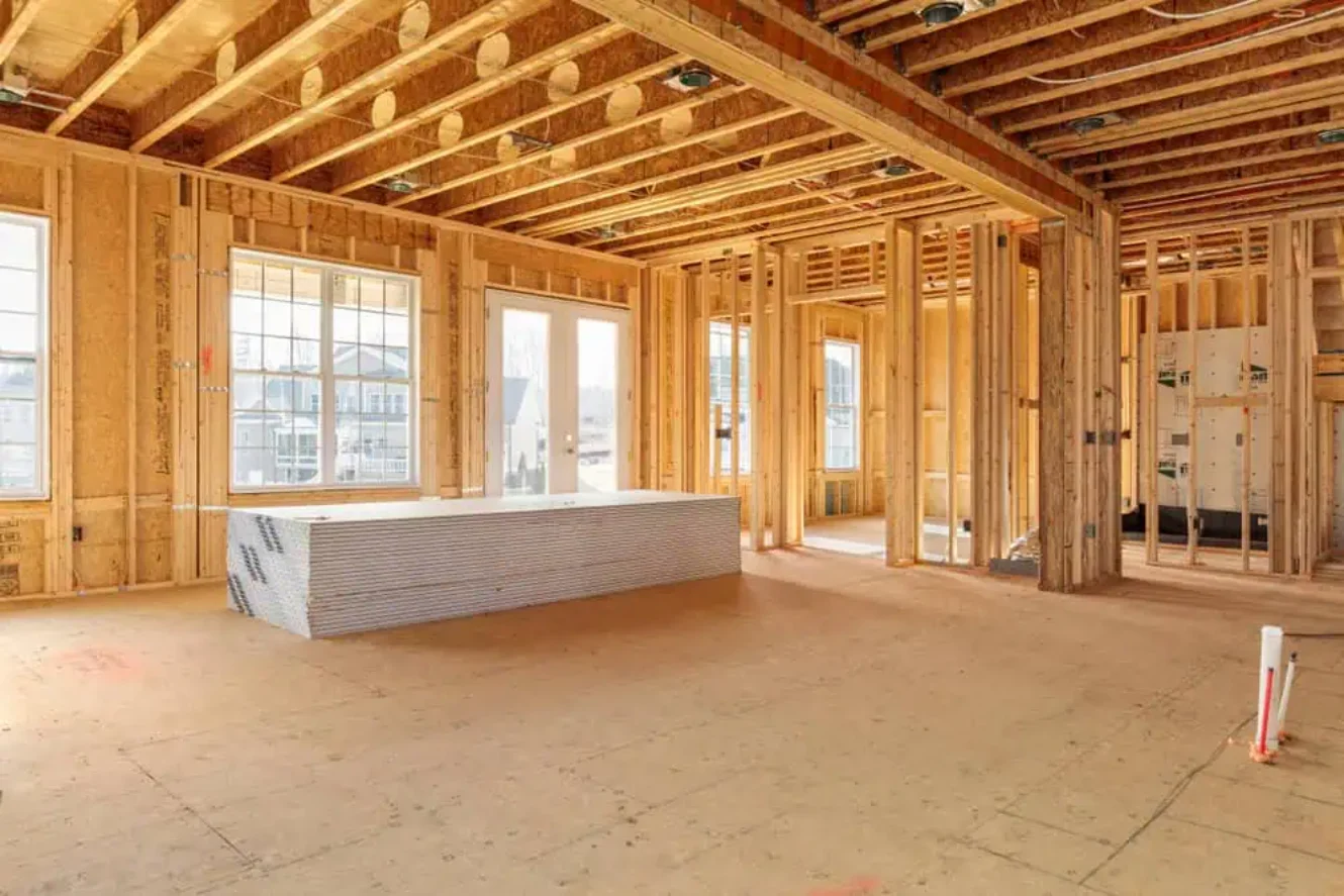 The wooden framing of a house addition under construction