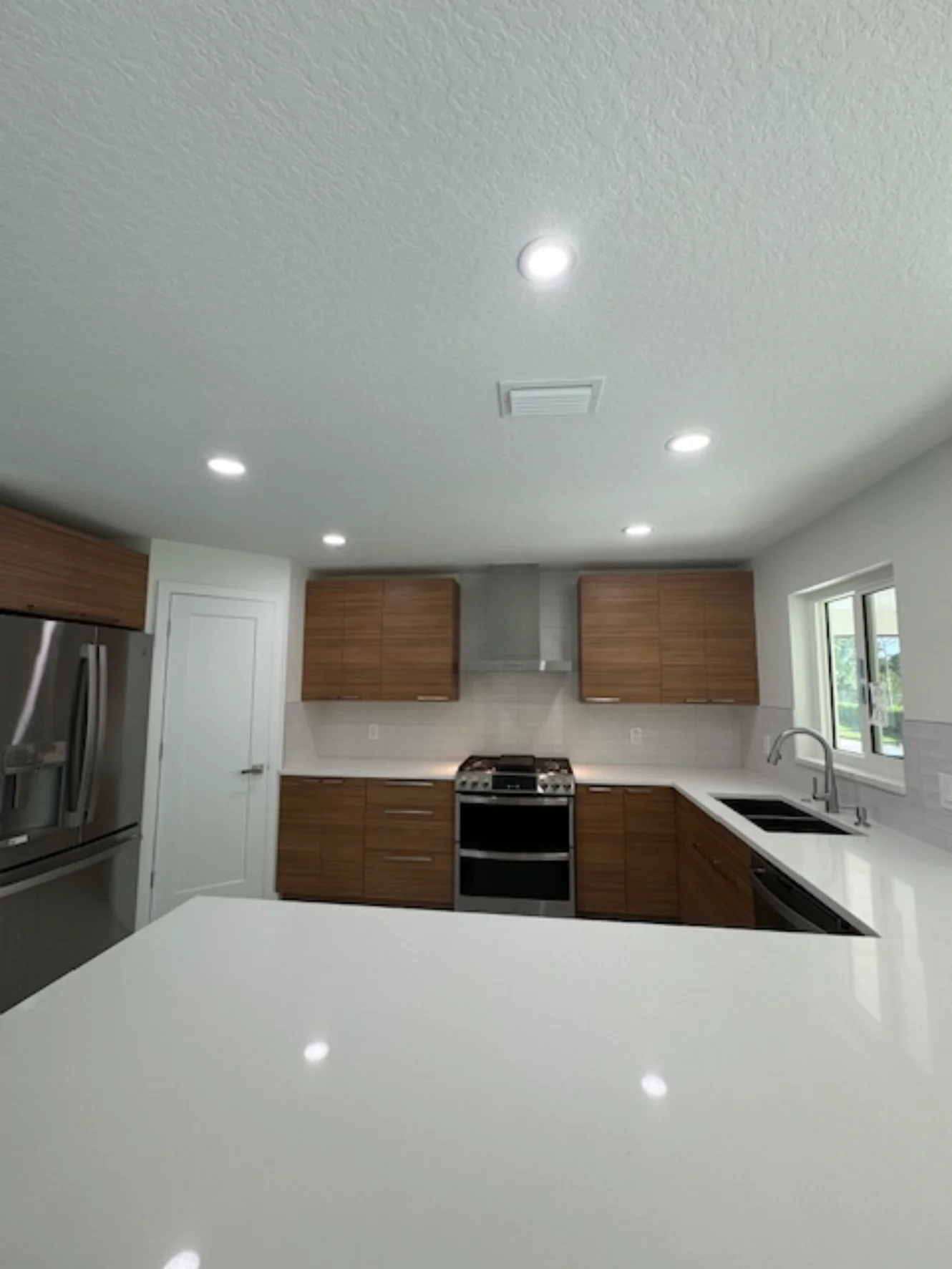 A completed modern kitchen remodel completed by BA Construction in Florida